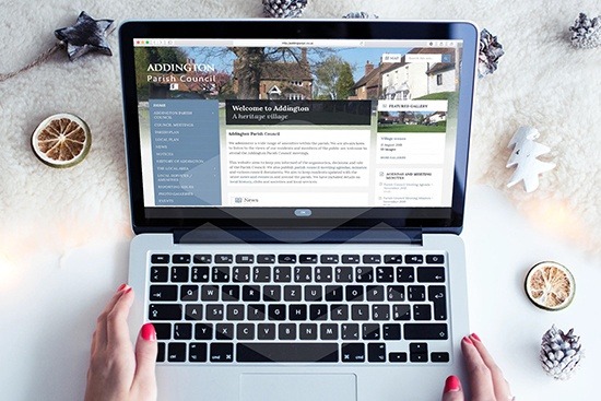 Addington Parish Council website screenshot on a laptop